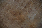 Distressed gold and aubergine Sivas carpet with faded lotus floral motifs and exposed foundation.