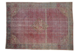 Distressed Kayseri carpet with a diamond medallion and Herati field in fuchsia, teal, and ivory tones.