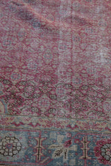 Distressed vintage Kayseri pile showing mostly even wear across the fuchsia and teal knot heads.