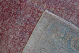 Hand-knotted back of a vintage Kayseri rug next to its distressed fuchsia pile.