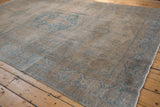 Evenly worn, low-pile texture of the dusty platinum field on a vintage Veece carpet.