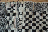 Vintage Moroccan rug's asymmetric ivory, charcoal, and salt and pepper checkered pile.