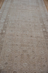Distressed vintage Hamadan runner with faded Herati pattern, abrashes, and neutral tones.