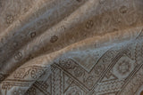 Distressed vintage Hamadan runner showcasing aged texture and neutral geometric border patterns.