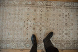 Distressed Hamadan runner showing allover Herati design, with time-softened ivory and blue.