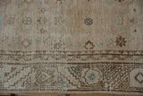 Distressed Hamadan runner detail: serrated geometric border, faded Herati motif, antique ivory, powder blue.