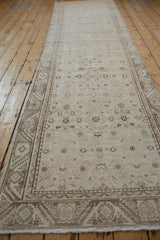 Distressed vintage Hamadan runner with worn Herati field and geometric border texture.