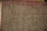 Soft high and low pile and original side selvage on a vintage distressed Oushak rug.