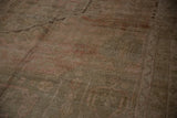 Varied pile height and soft texture on a distressed vintage hand-knotted Oushak carpet.