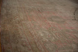 Varied high and low pile shows the soft texture of a distressed Oushak carpet.