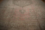 A ground-level view highlights the polished sheen of this vintage distressed Oushak carpet.