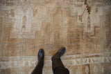 Distressed Kars carpet showing worn pile, subtle primitive patterns, and muted earthy tones.