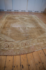 Distressed Vintage Kars carpet corner with worn pile, serrated gul finials on abrashed ground.