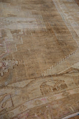 Vintage distressed Kars carpet, abrashed ground, geometric primitive relief, mostly even wear.