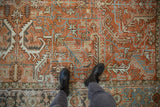 Distressed hand-knotted Mehrivan carpet with terracotta and sky blue geometric pattern.