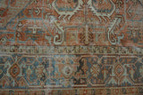 Distressed Mehrivan carpet pile, geometric terracotta and blue field with Samovar Turtle border.