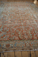 Close-up of distressed Mehrivan carpet border, terracotta and dusty blue Samovar Turtle design.
