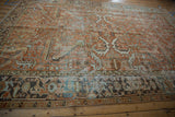 Distressed vintage Mehrivan carpet, geometric vines, classic Samovar Turtle border, terracotta and blue.