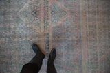 Decorative distressed texture on a vintage Bijar carpet with pops of bubblegum pink and dusty teal.
