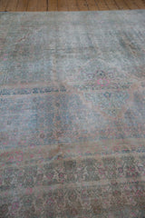 Low angle view highlighting the heavy abrashes and even wear on a vintage distressed Bijar carpet.