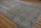 Heavy abrashes and even wear create a soft, faded surface on this vintage Bijar carpet.