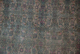 Close-up showing heavy abrashes and even wear on the hand-knotted pile.