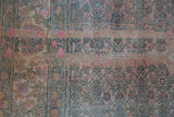 Heavy abrashes and even wear to the knot heads on a vintage distressed Bijar carpet.