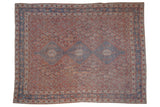 Distressed Qashqai carpet with a triple blue medallion on a faded, ornate cinnabar red field.