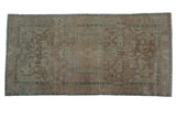 Distressed Malayer runner, faded medallion, intricate floral design in brown, ivory, and pale blue.