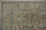 Distressed vintage Malayer runner corner featuring geometric floral motifs in pale ivory and blue tones.