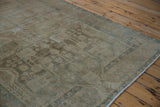Distressed pile and faded blue floral motifs on a vintage Malayer runner.