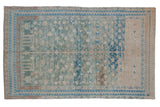 Distressed Persian Hamadan rug with a geometric tree of life motif in dusty teal and blue tones with heavy abrashes.