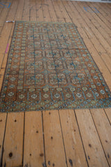 Distressed Afghani Belouch rug with prominent geometric elephant footprint guls.