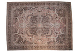 Vintage distressed Khoy rug: prominent quatrefoil medallion, floral patterns, dusty mauve and charcoal.