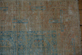 Textured close-up showing worn knot heads, geometric guls, and the side selvage.