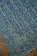 Faded powder blue and ivory tones on a distressed Hamadan rug runner border detail.