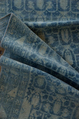Folded vintage Hamadan runner, showcasing distressed pile with powder blue botehs and faint foundation.