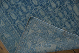 Distressed blue pile shows faint foundation, exposing hand-knotted Persian Hamadan rug construction.
