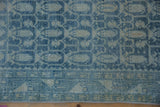 Powder blue botehs and vinery on a distressed Hamadan runner with faint foundation showing.
