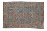 Vintage Distressed Shiraz rug with faded sky blue medallion, terracotta floral field, 3'1