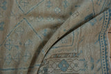 Distressed Afshar rug pile showing abrashes, oxidized silver, and pale sapphire blue geometric motifs.