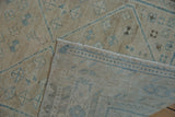 Distressed Afshar rug pile texture, showcasing faded blue geometric patterns and tightly woven foundation.