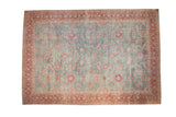 Vintage distressed Yezd carpet with an allover scrolling floral pattern in dusty blue, fuchsia, and burgundy.