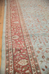 Distressed vintage Mahal rug: wine burgundy border with foliage, dusty blue field with vinery.