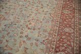Distressed dusty powder blue field with delicate vinery and a wine burgundy floral border.