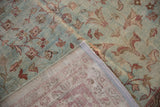 Mahal carpet's distressed dusty blue pile, revealing foundation, vinery, and side selvage.