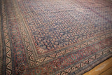 Classic Samovar turtle design border of a vintage Tabriz carpet, in dusty red, navy, and ivory.