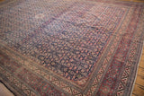 Vintage Tabriz rug detail: Herati field, Samovar turtle border, navy, red, and blush tones.