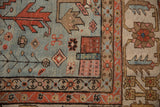 Corner detail of a collector Bakshaish carpet showing primitive motifs and even wear to the knot heads.