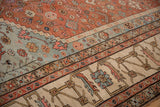 Primitive floral and geometric borders on a hand-knotted antique Bakshaish collector carpet.